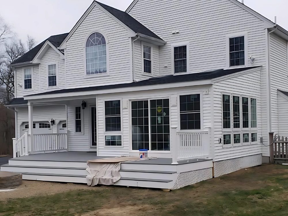 Completed sunroom and deck addition built by Lagace Construction to expand outdoor living space